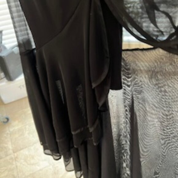 Black formal girls dress with multiple layers of sheer ruffles at the bottom. - Picture 5 of 7